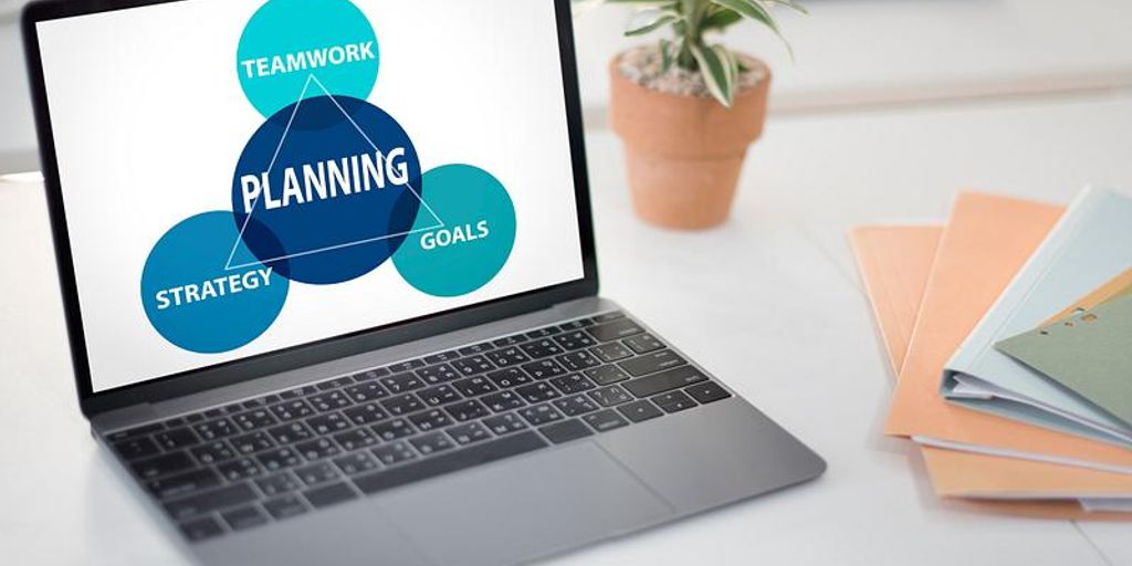 entrepreneur planning expansion on laptop with German landmarks in background